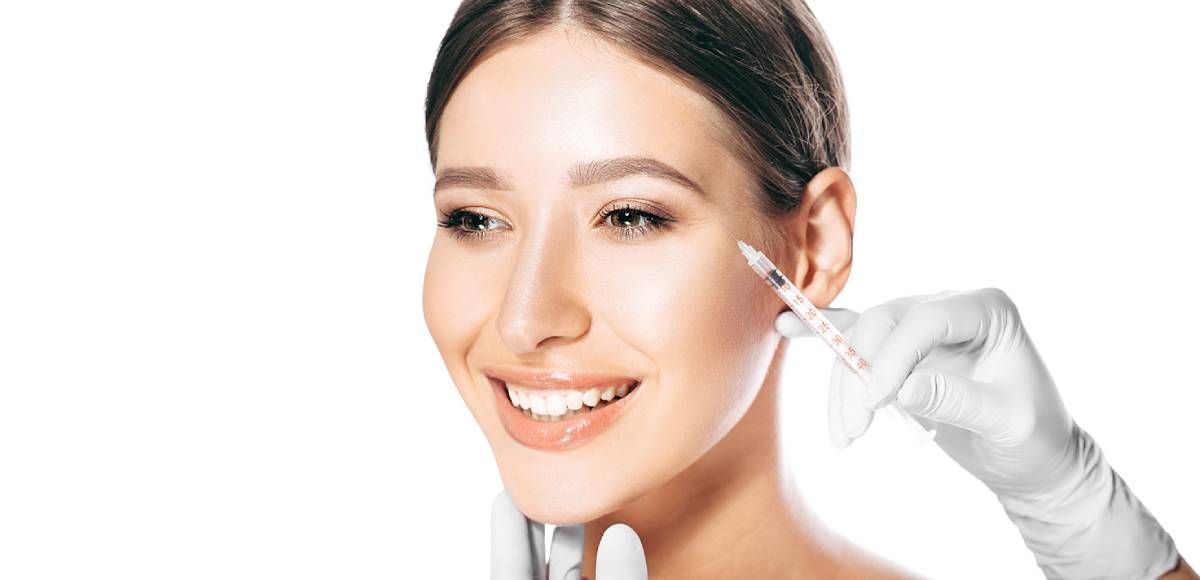 Woman receiving injectables for cosmetic treatment.