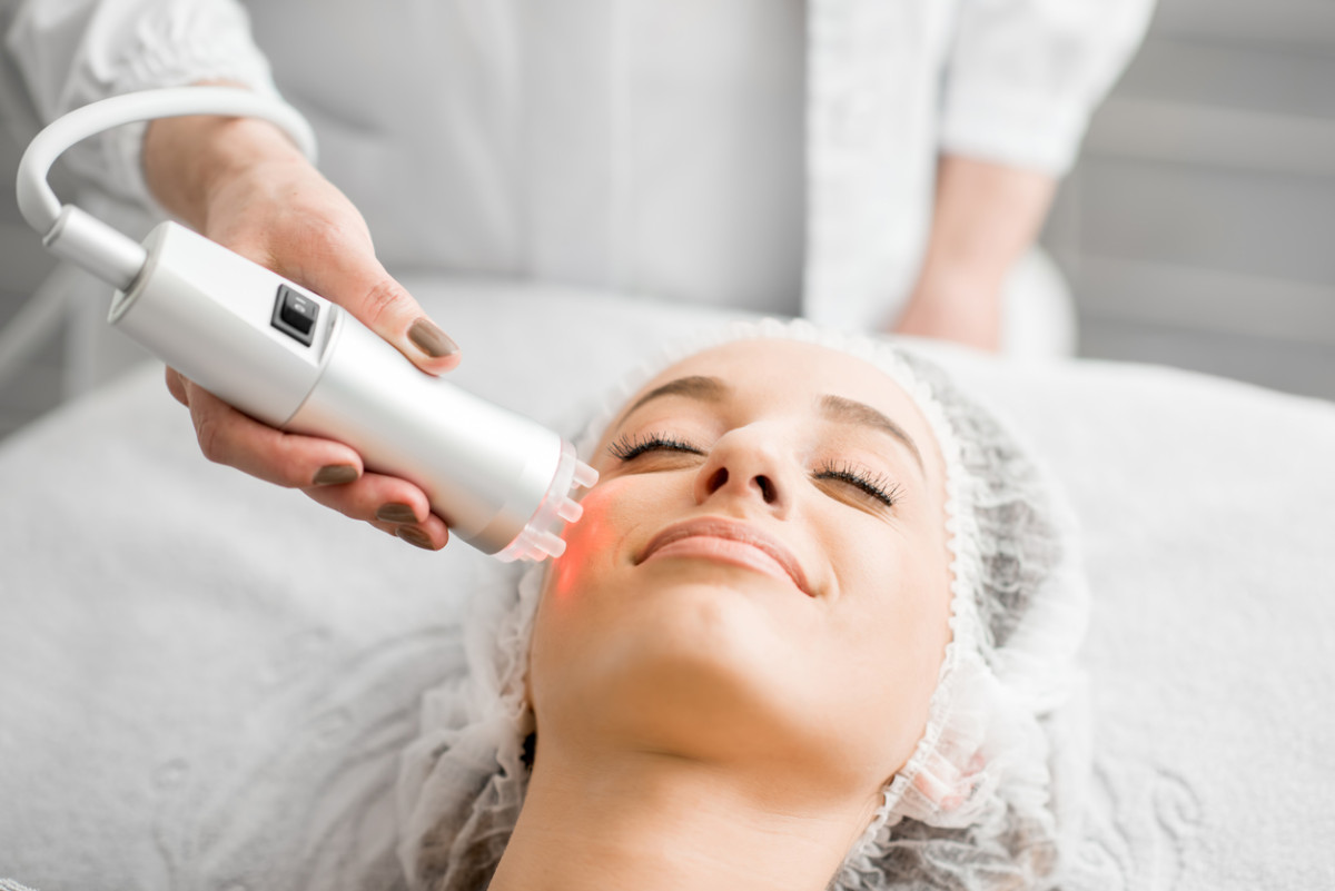 Woman getting skin tightening with laser